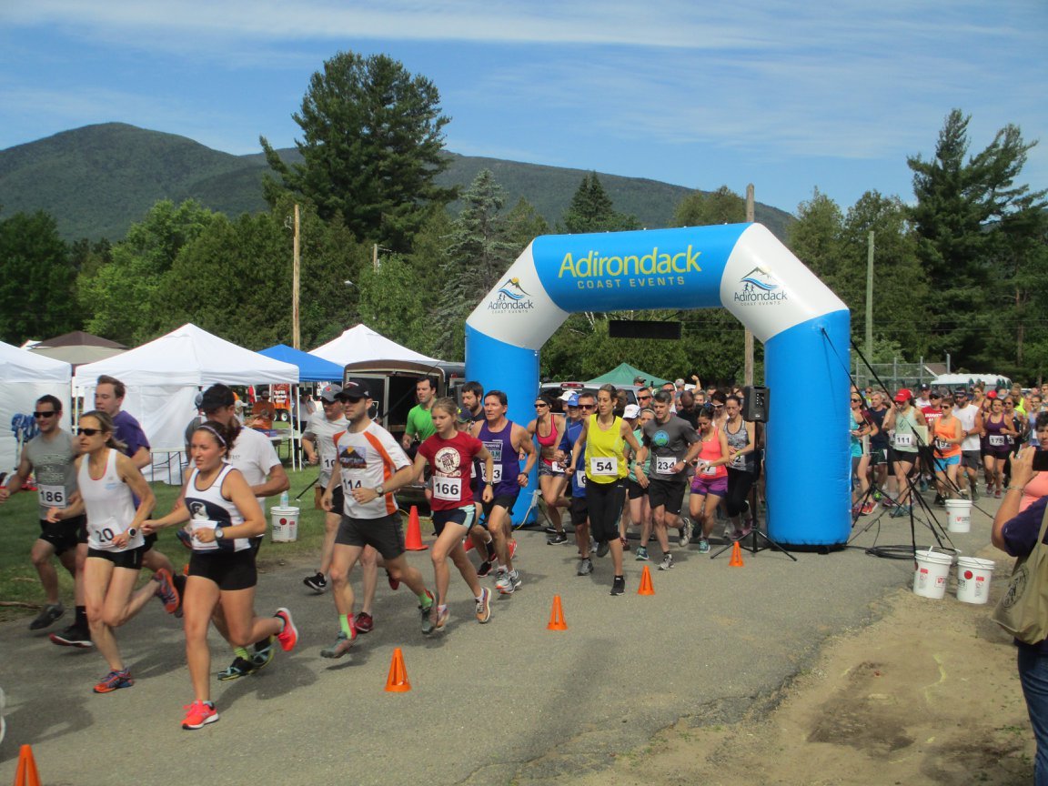 Runners taking off at the starting line at the Wilmington Whiteface Whiskey Run.