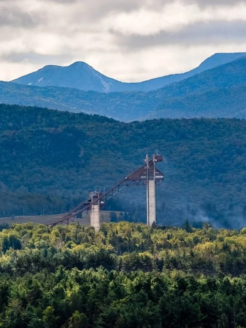 View of the Lake Placid Olympic ski jumping complex with the Adirondack High Peaks in the background.