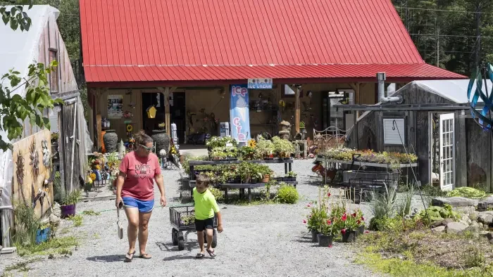 Family buying plants at It's About Thyme Farm and Garden Center.