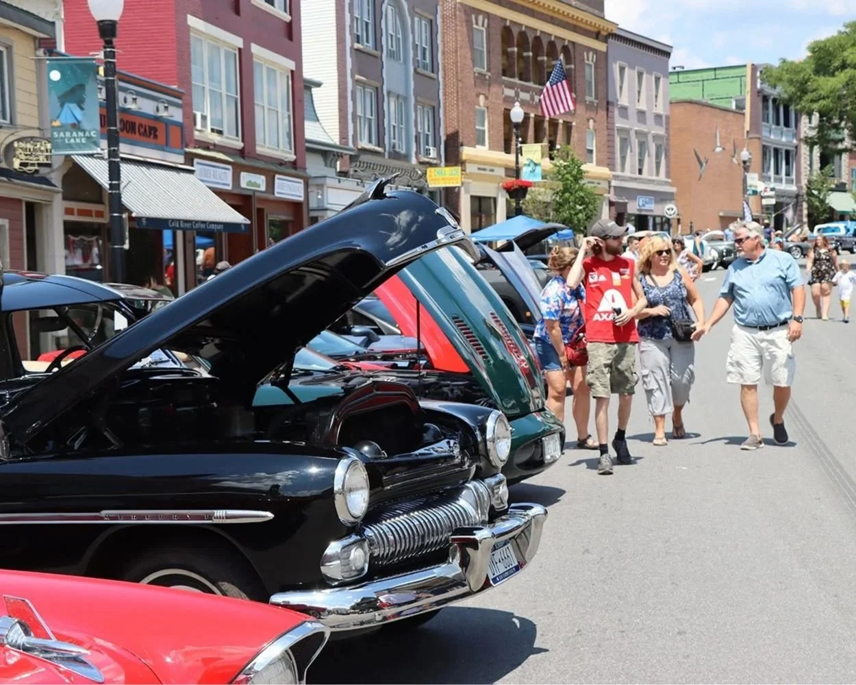 People attending the Cruisin Car Show in Saranac Lake.