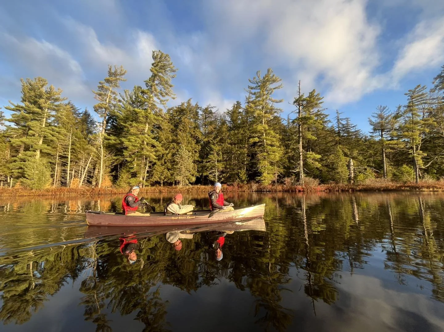 Students commuting to campus via kayak or canoe at St. Lawrence University's Adirondack campus.
