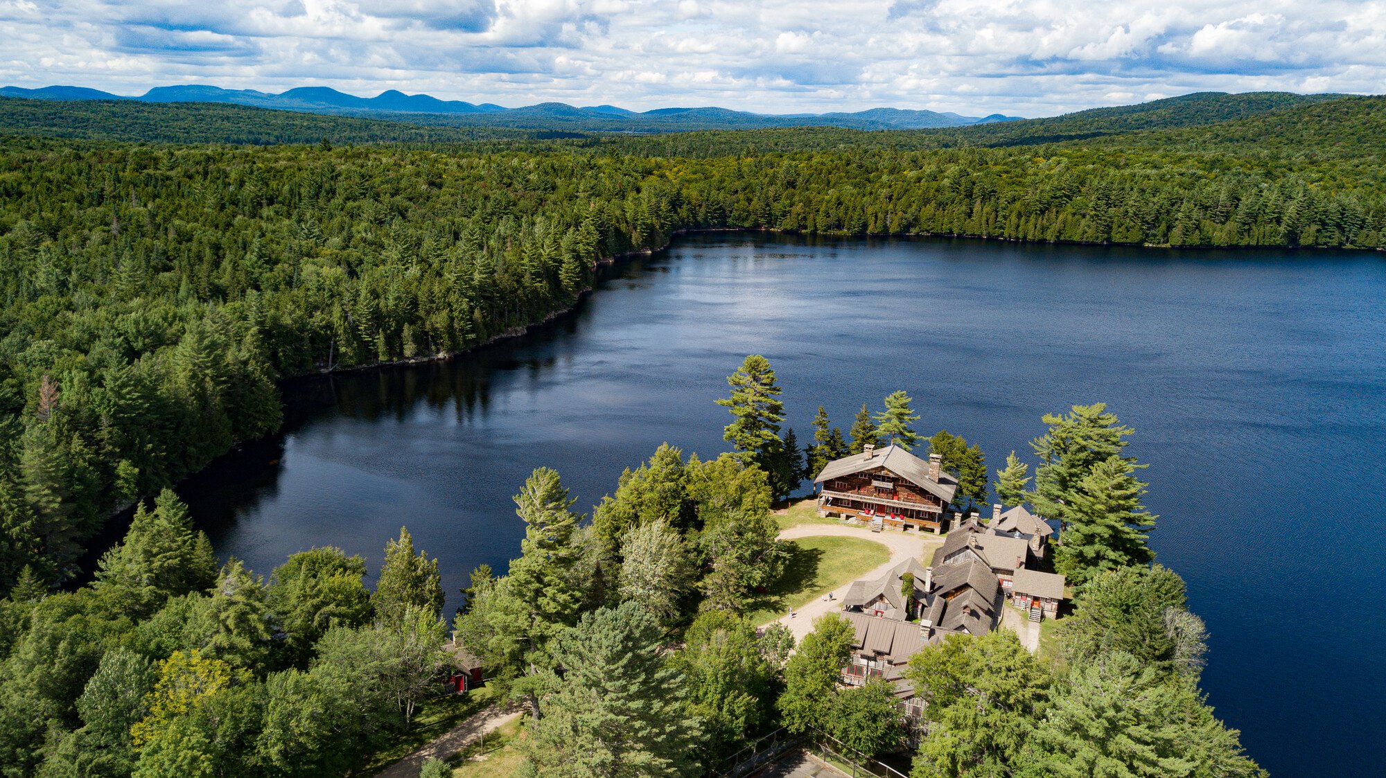 Aerial image of Great Camp Sagamore overlooking Lake Sagamore in the Adirondacks.