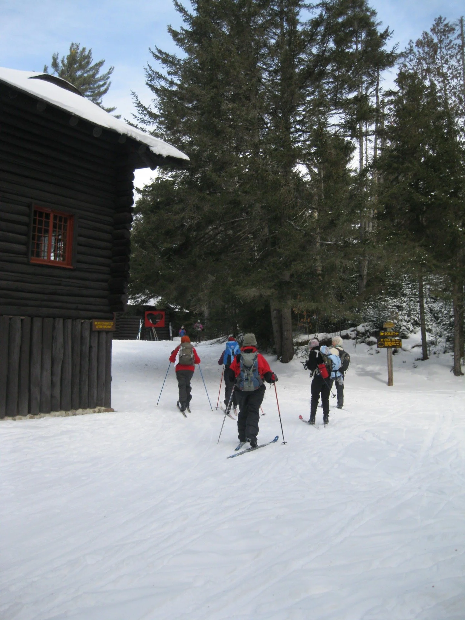 Image of xc skiers at Great Camp Santanoni on a Winter Weekend in January.