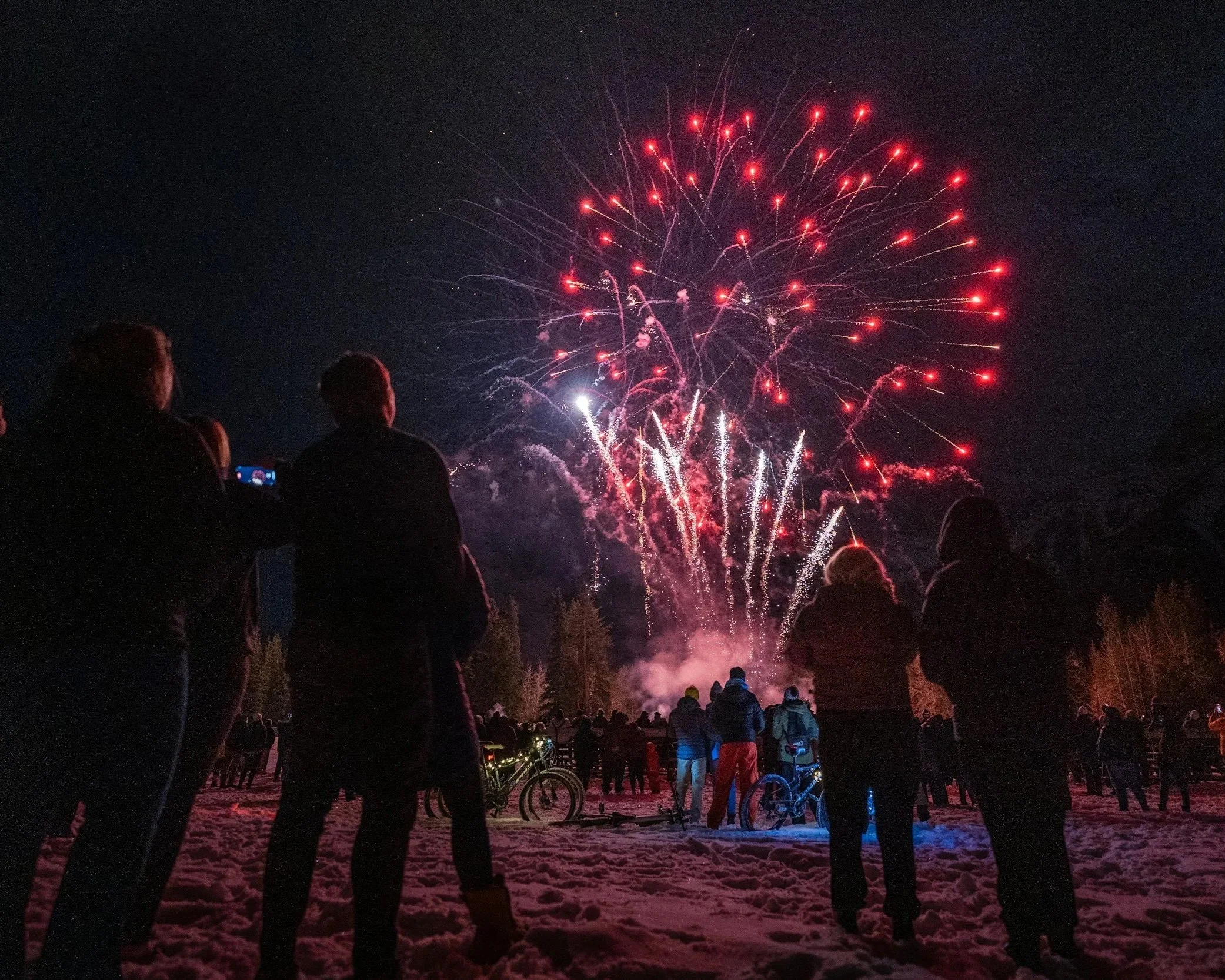 Winter fireworks at night during a winter carnival in the Adirondacks.