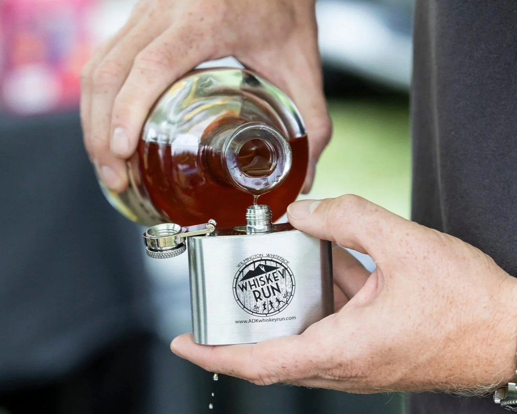 Flask being filled at the Willmington Whiskey Run & Festival