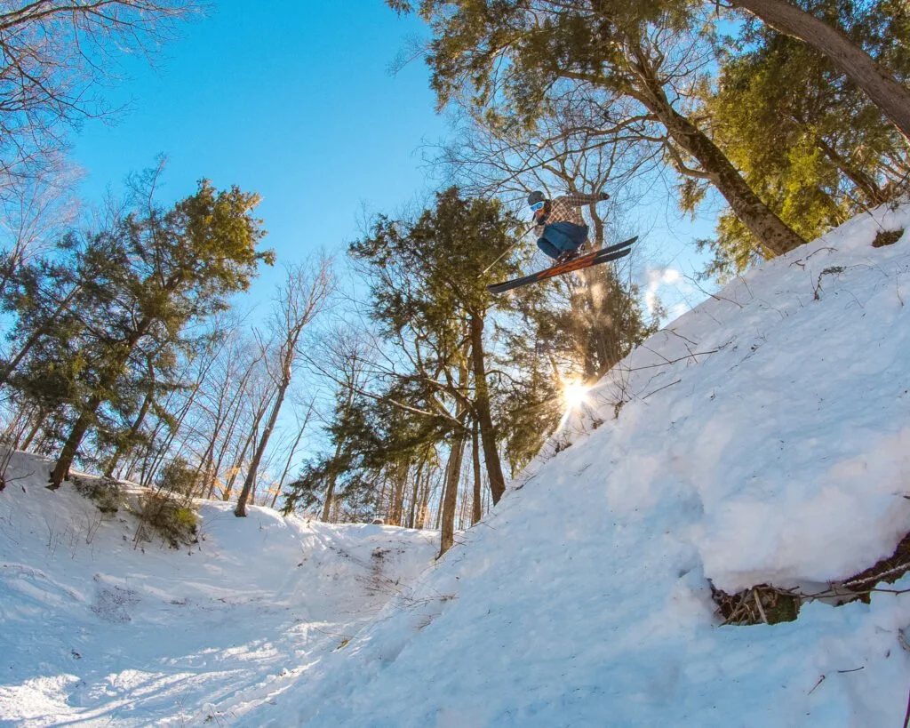 Skier enjoying deep, fresh powder snow at Snow Ridge in Turin, NY.
