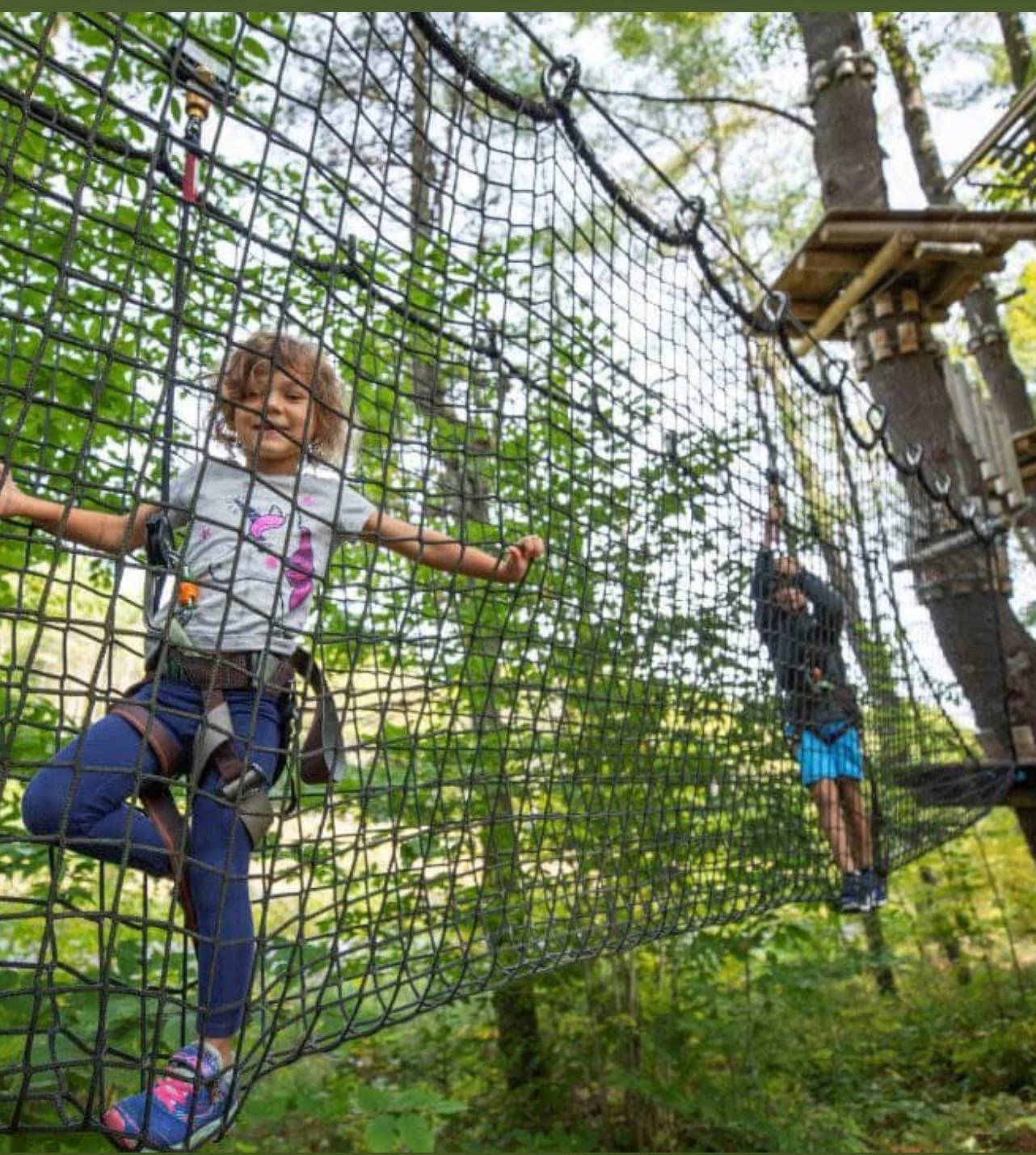 Kids on rope course in the Adirondacks near Lake George.