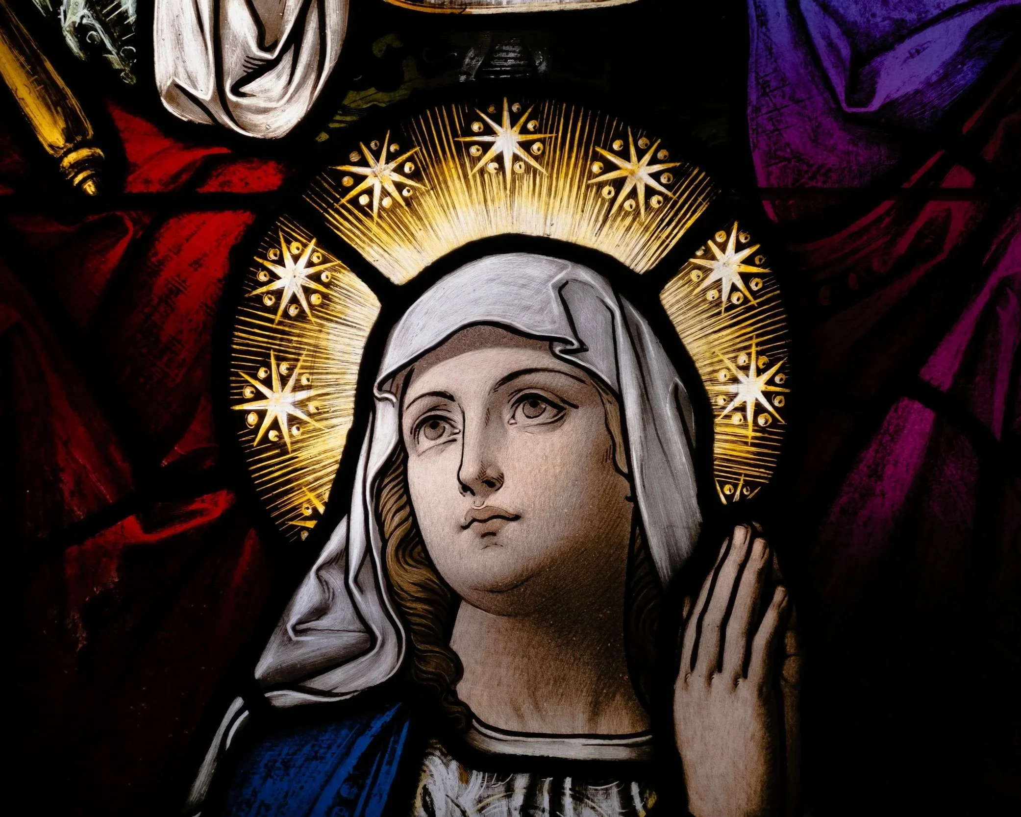 Stained glass window of our lady of perpetual help.