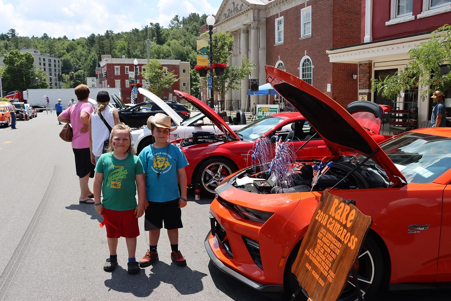 Two kids attending the Cruisin Car Show in downtown Saranac Lake.