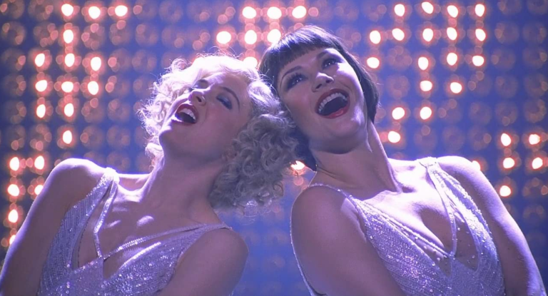 Catherine Zeta Jones as Velma Kelly and Renee Zellweger as Roxie Hart in Chicago, the musical movie.