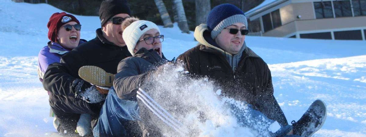 Sledding at Silver Bay YMCA's annual winter weekend in February.