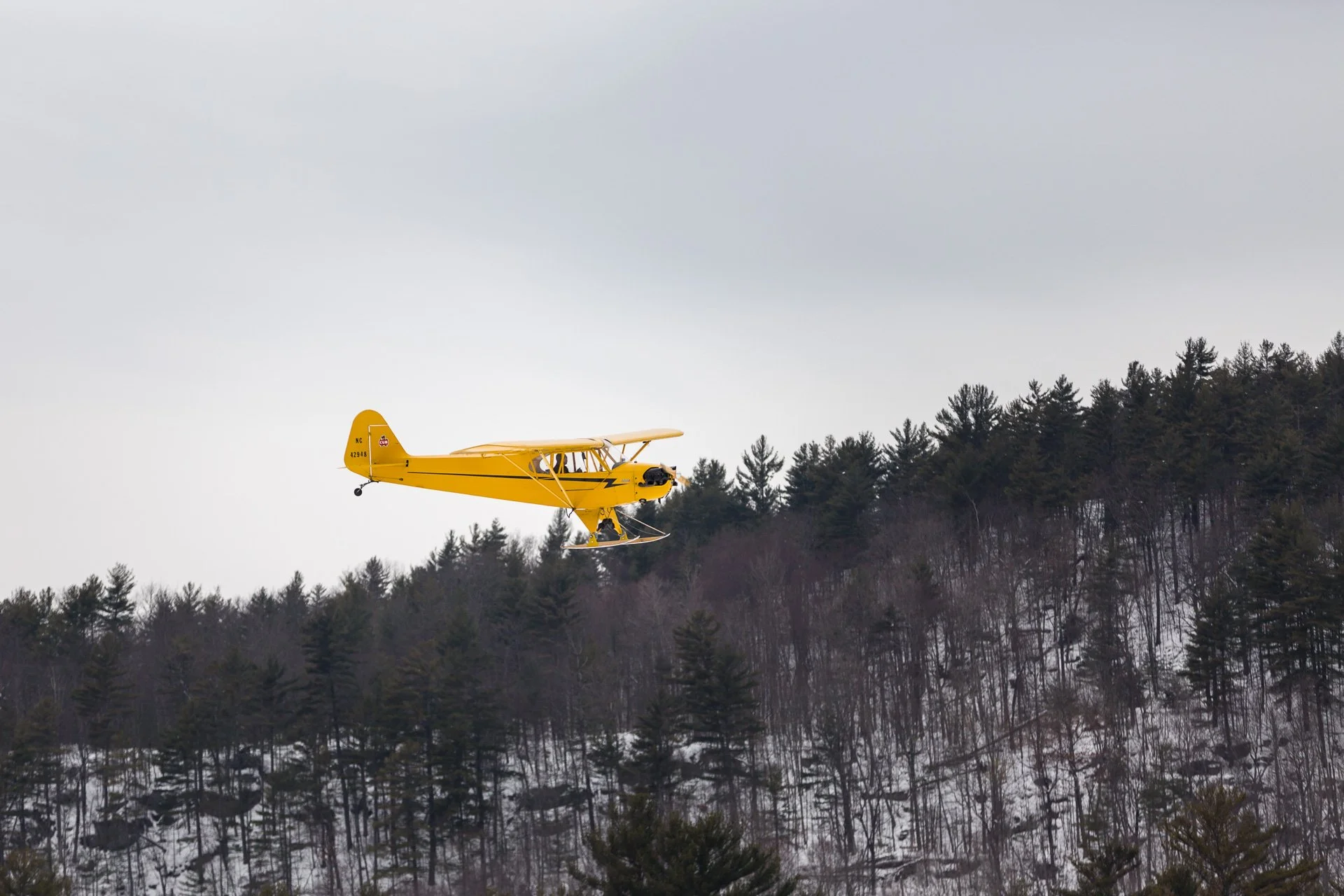 Plane landing on Brant Lake during the annual Winter Carnival.