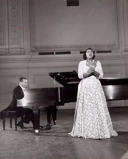 Opera performer Marian Anderson performing with a pianist accompanist.