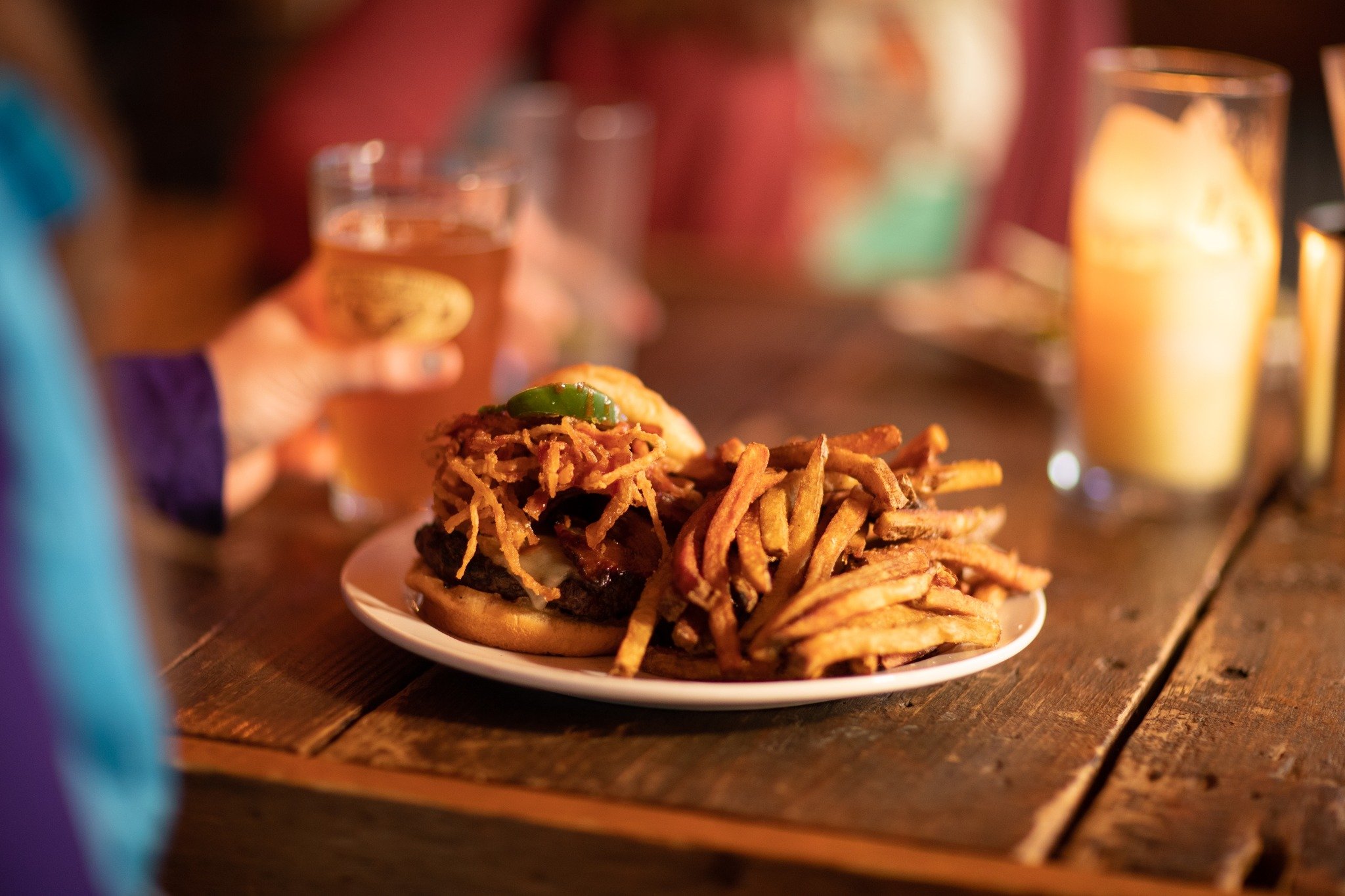 Bitters and bones burger with crispy onions in Saranac Lake.