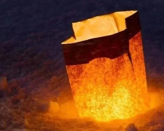 Winter solstice luminaria lights the night.
