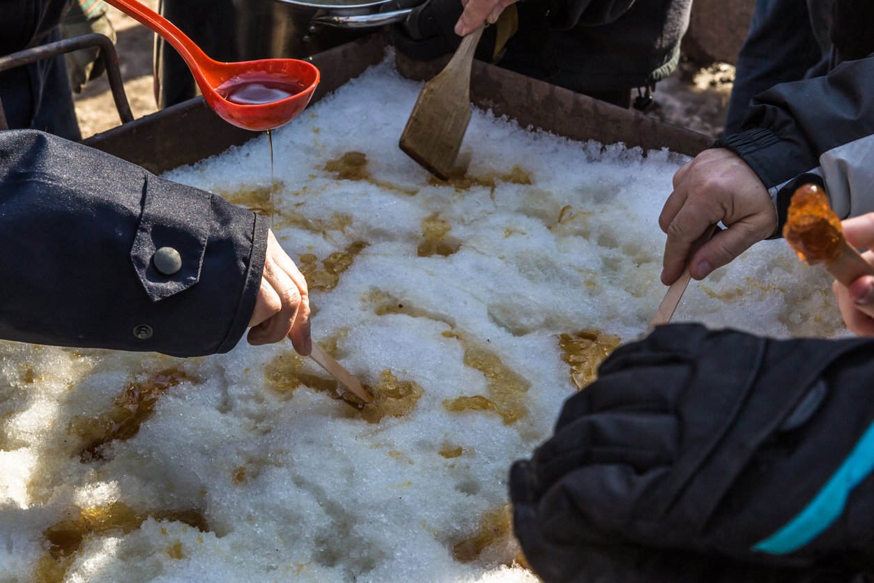 Freezing maple syrup in the early spring snow in the Adirondacks