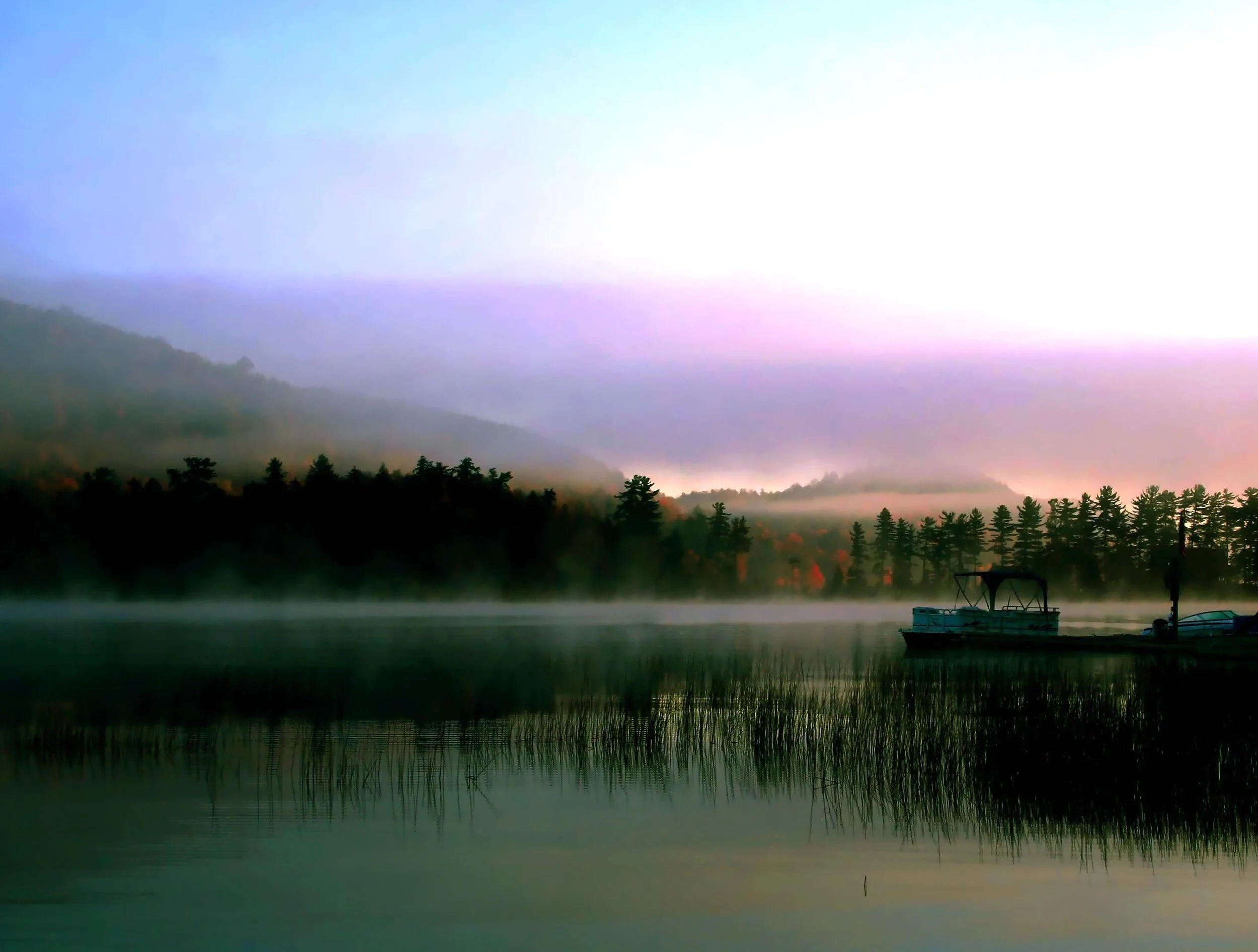 Misty morning on Big Moose Lake, site of the Adirondack true crime story of Chester Gillette and Grace Brown.
