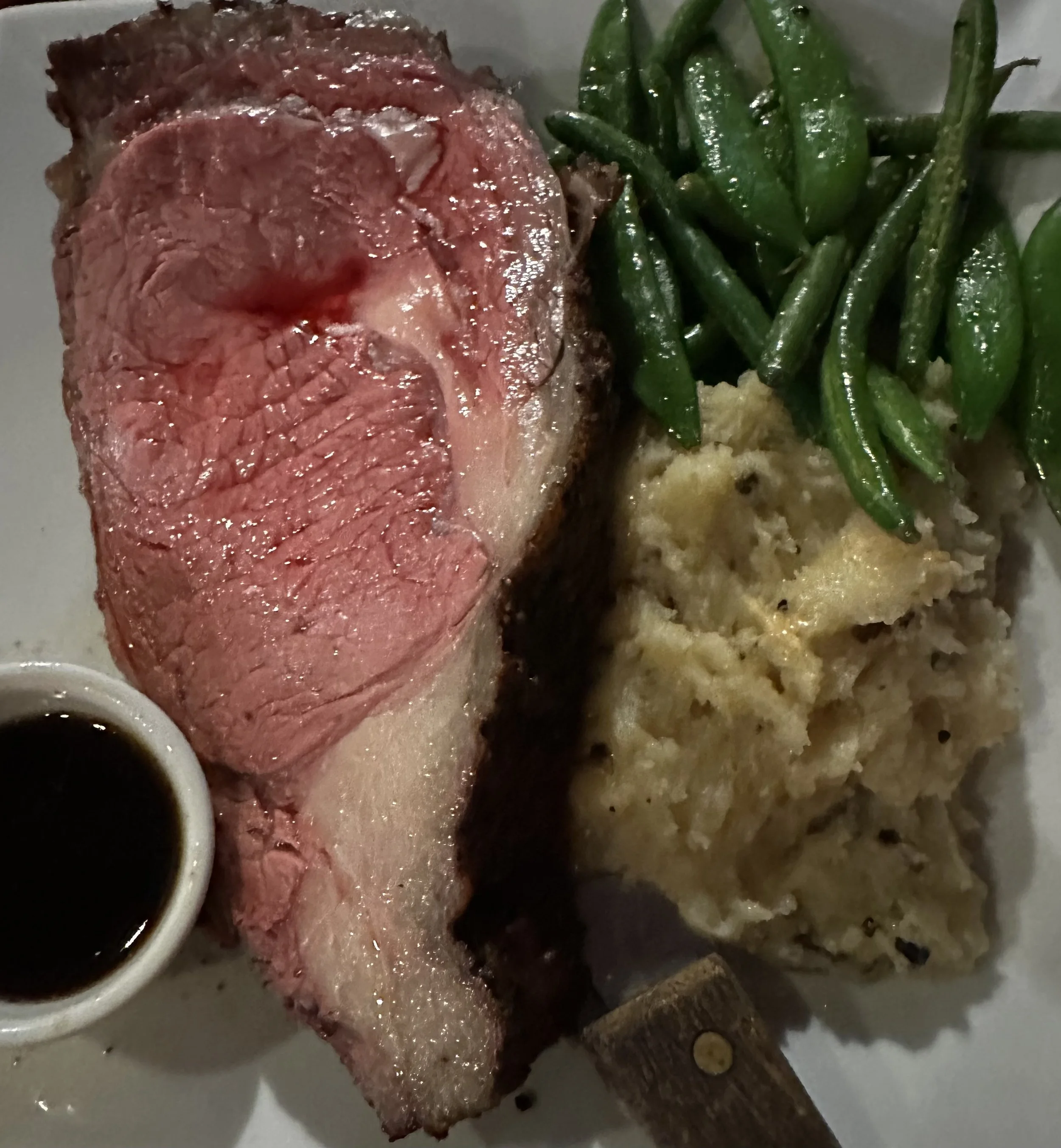 Rare prime rib dinner with truffled potatoes from Sullivan's Firehouse.