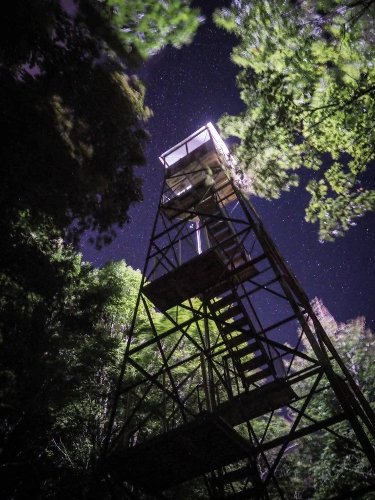 Illuminated fire tower on Swede Mountain near Lake George in the Adirondacks.