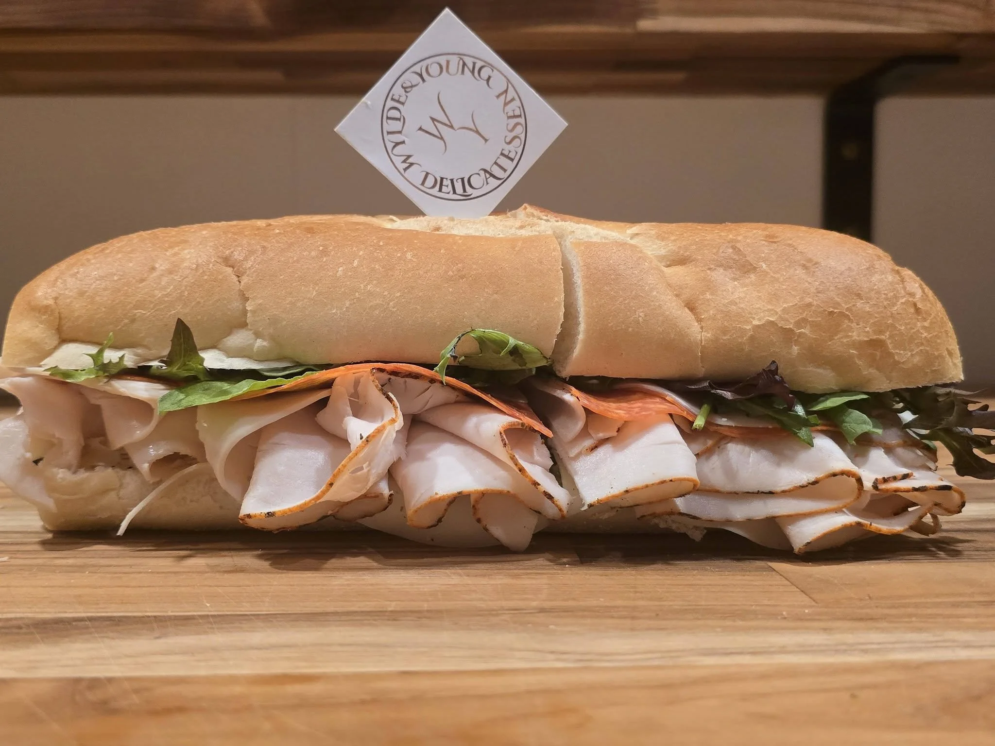 Large fresh-made turkey sub and wylde and young delis