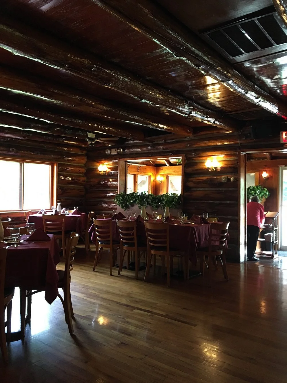 Wood-beamed dining room at The Ridge Terrace restaurant near Lake George Village.