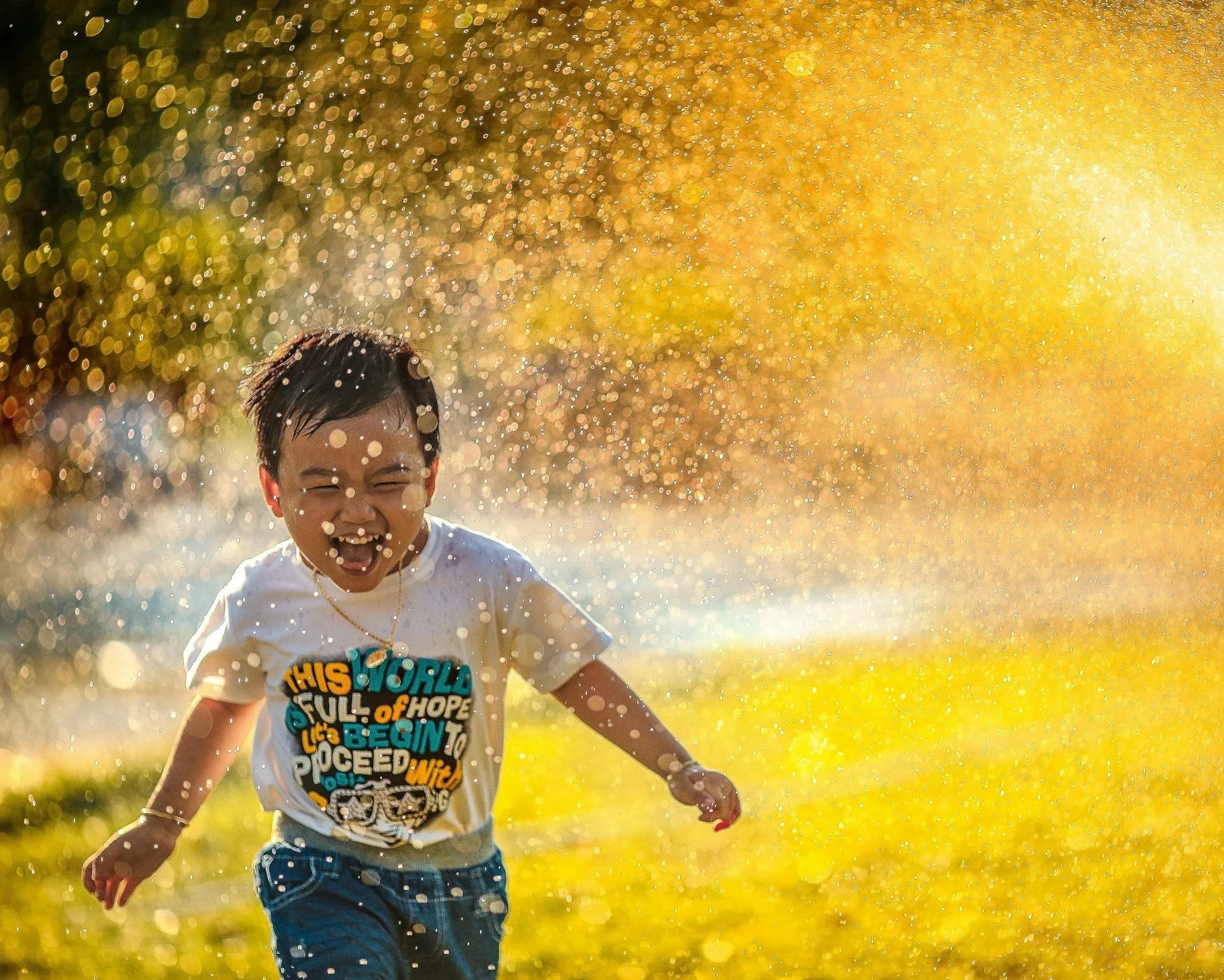 Child playing in water at Field Day
