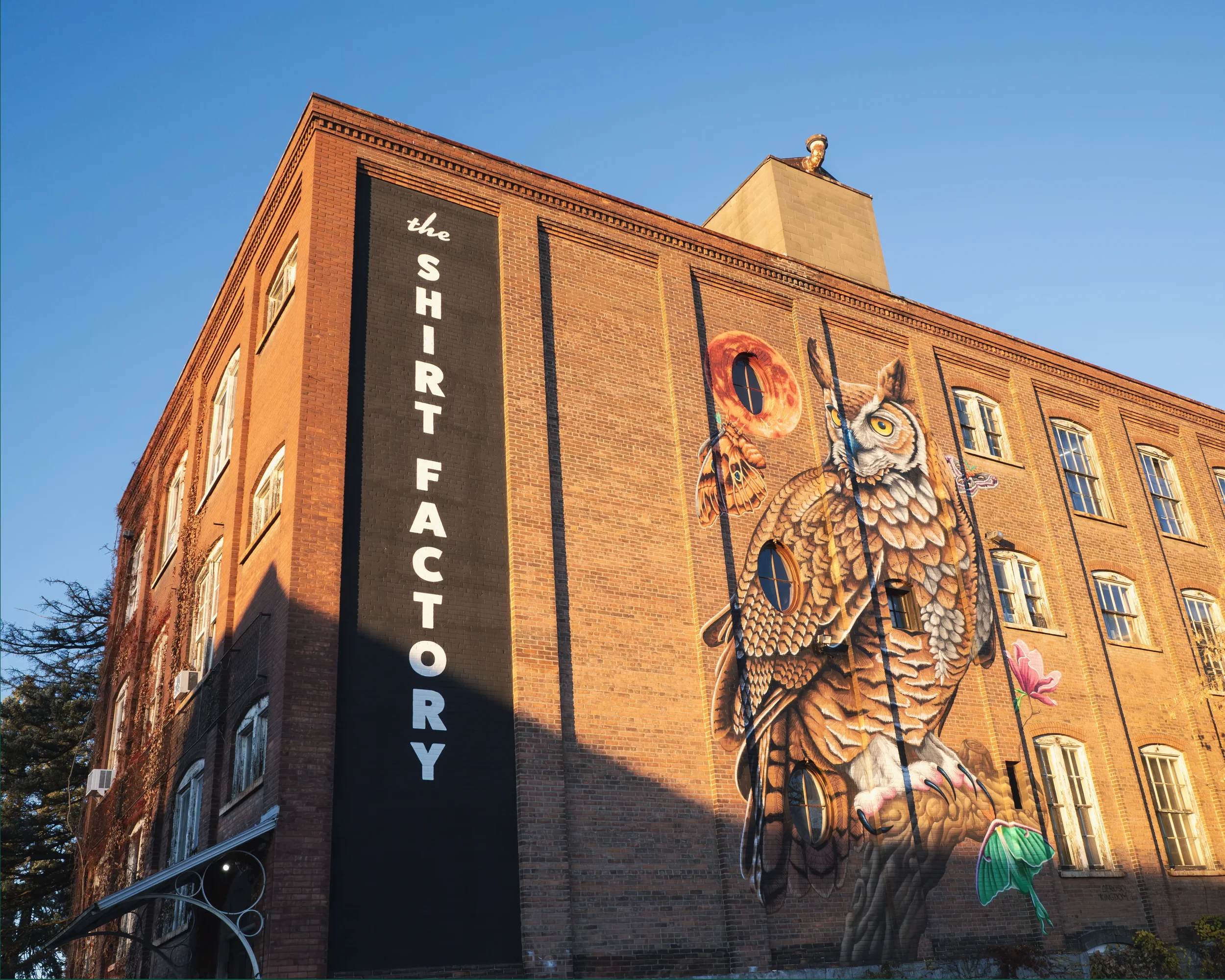 The Shirt Factory Glens Falls exterior showing a mural by a talented artist.