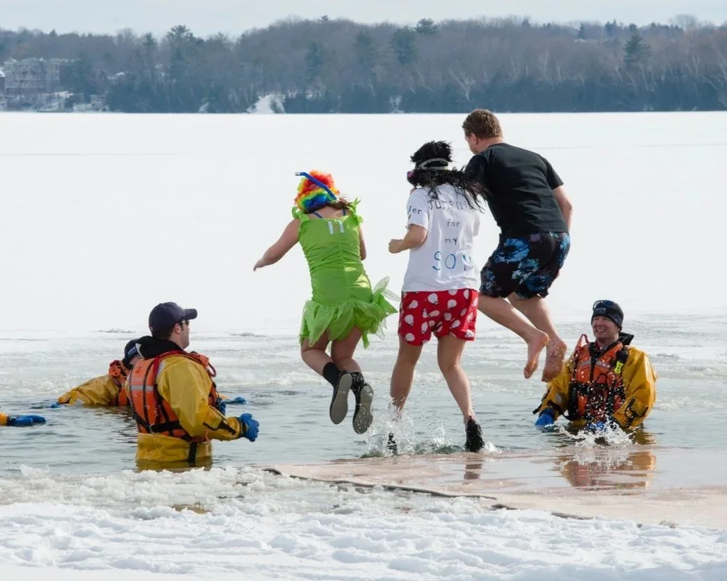 Swimmers taking a polar plunge in icy long lake, ny.