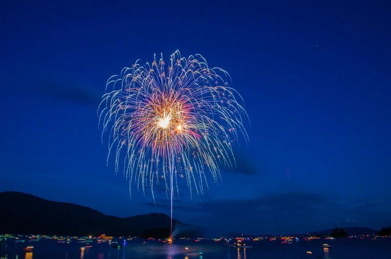 Spectacular July 4th fireworks display over Lake George Village in the Adirondacks.