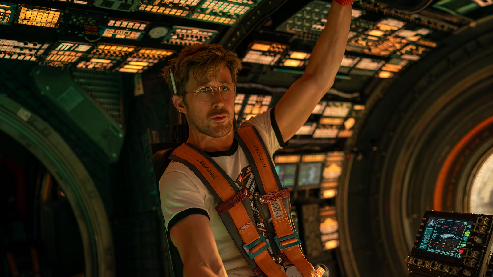 The actor Ryan Gosling in the movie "Project Hail Mary" as an astronaut in a space vehicle.