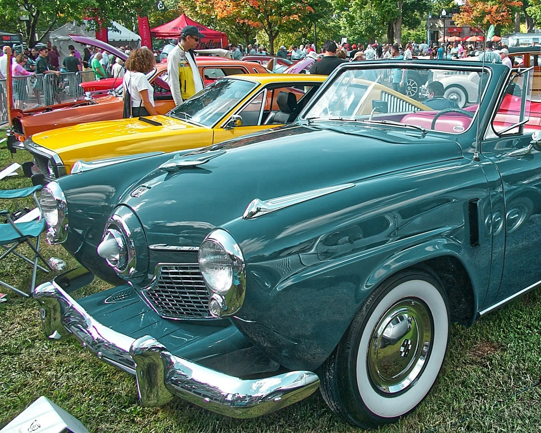 restored vintage car at car show.