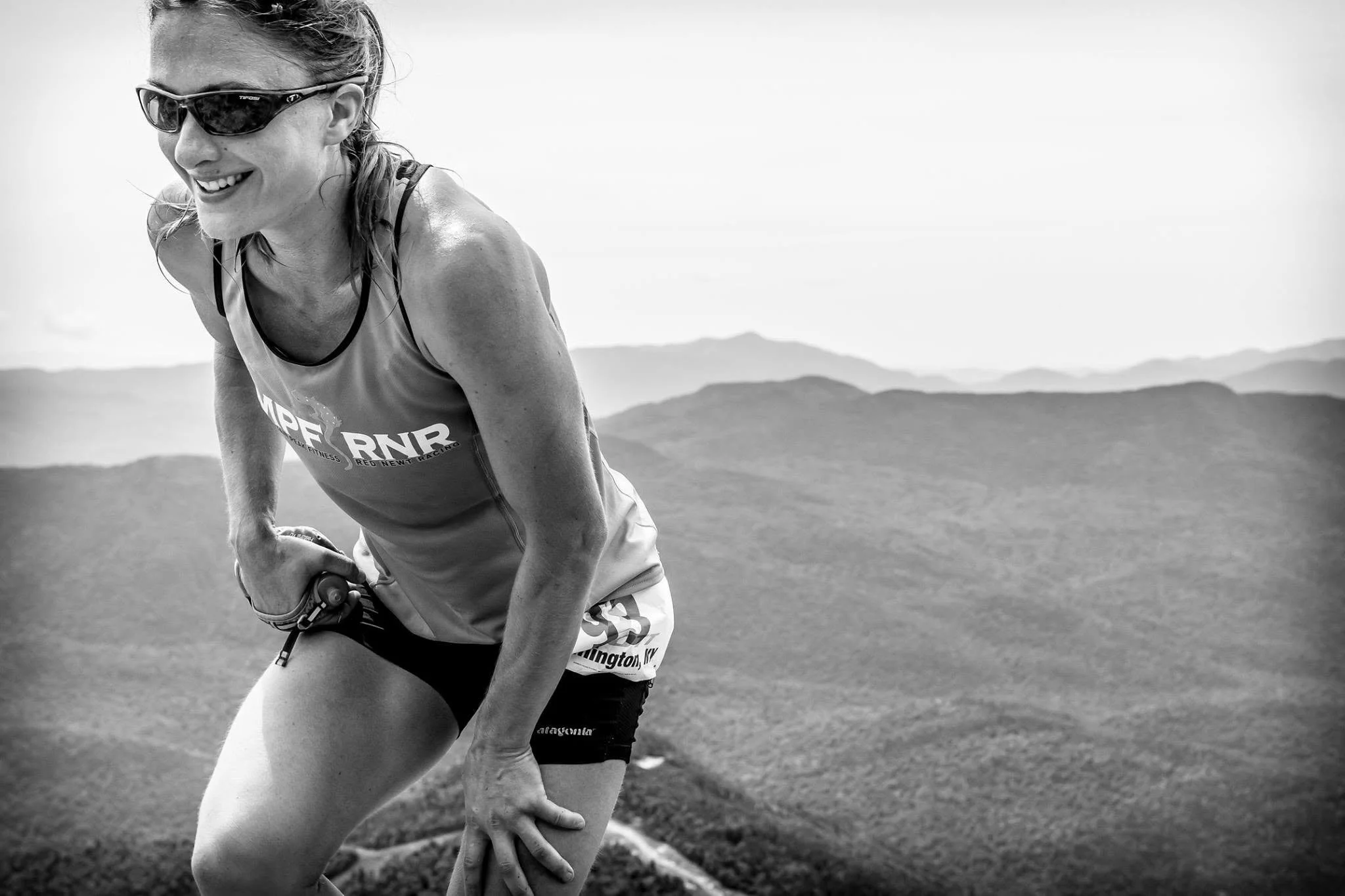 Woman running up Whiteface Mountain.