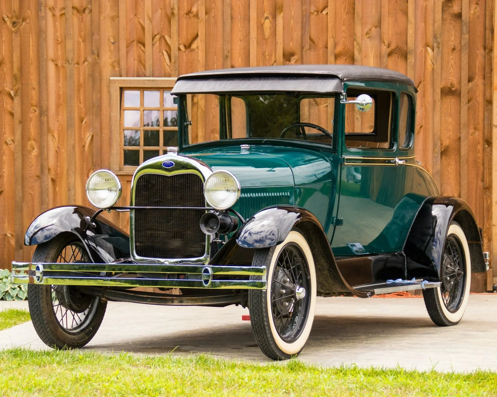 Classic antique model T ford at a car show.