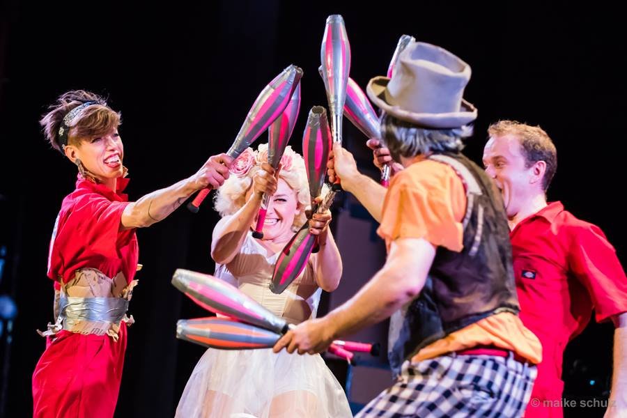 Bindlestiff Family Circus performers juggling.