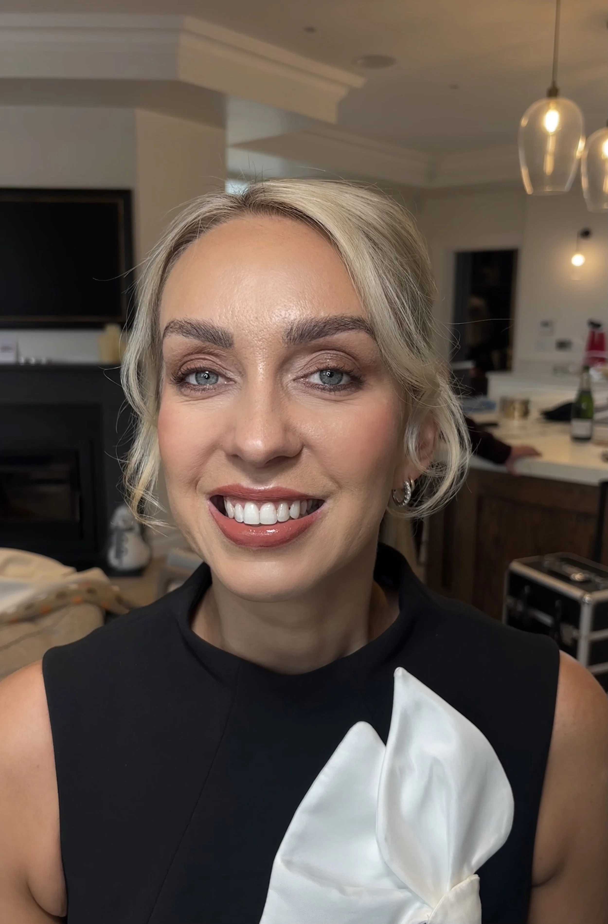 A beautiful wedding guest posing for a photo. Makeup by Limerick based bridal and event makeup artist beauty by booms. .