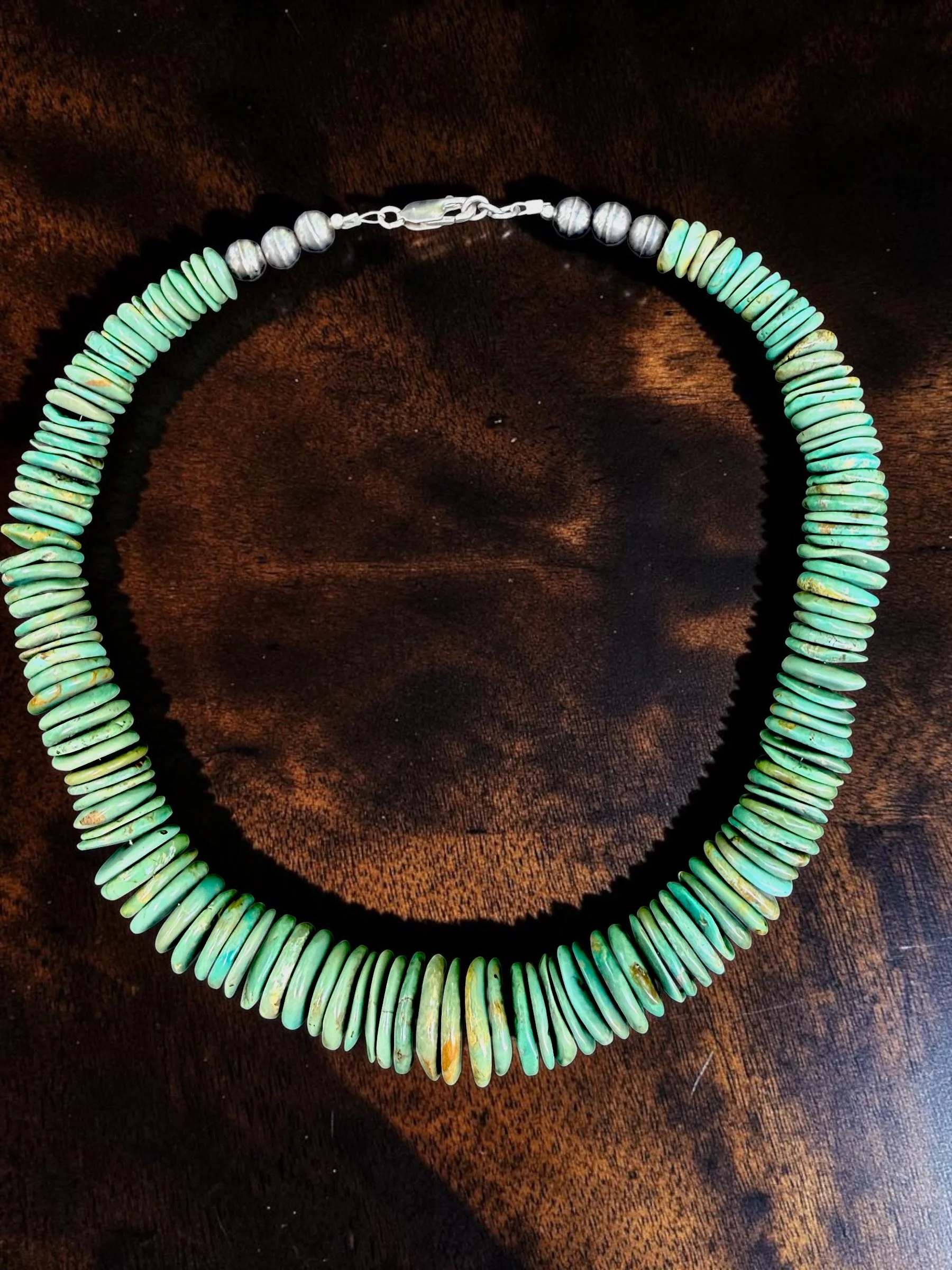 Turquoise Graduated Disc Necklace
Turquoise, sterling silver
Unmarked, Contemporary restringing
