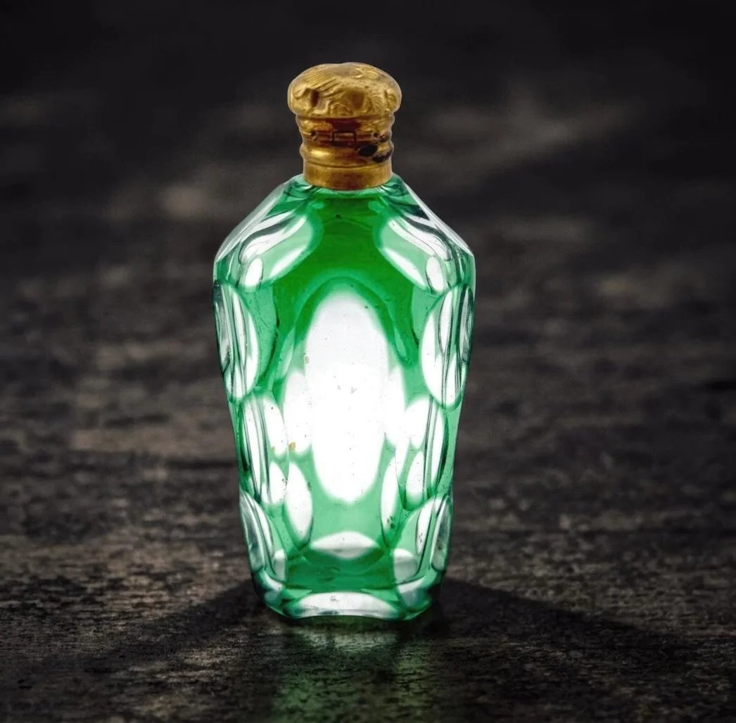 Antique emerald green art glass scent bottle, brass figural cap, contents residue, c. 1900–1910 — $195