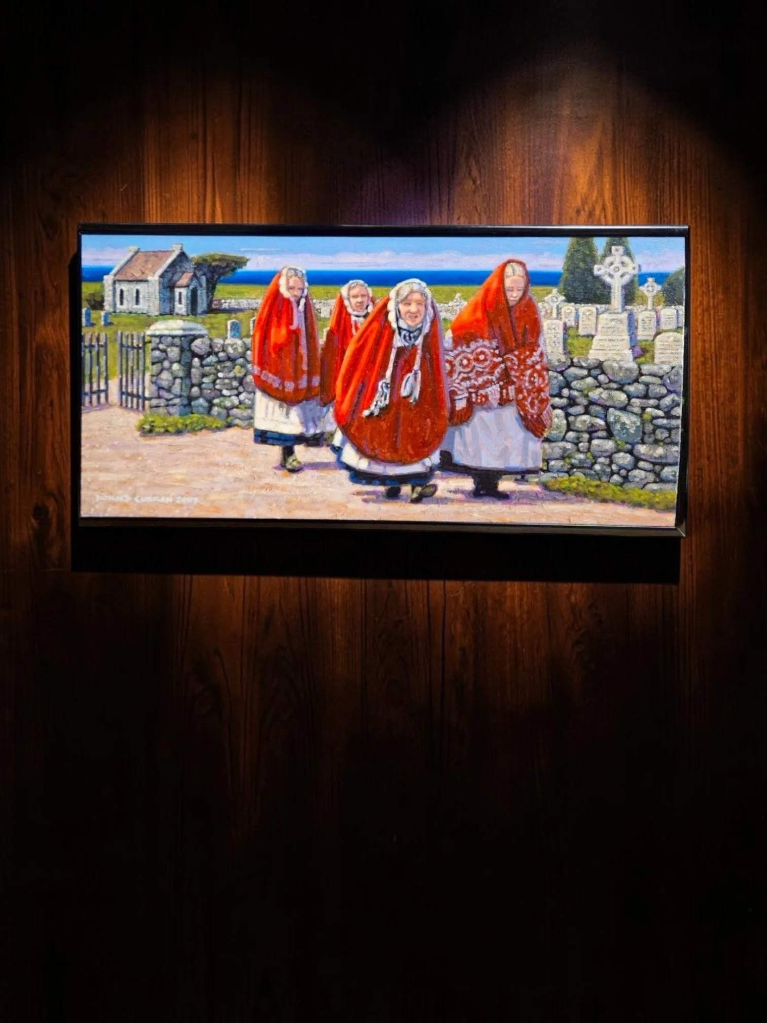 Donald Curran “Women of Aran,” Irish Figurative Oil Painting, 2007
Donald Curran, “Women of Aran,” 2007, oil on board, four women in traditional red Galway shawls walking beside a stone wall and cemetery, sea visible beyond, verso documentation refer