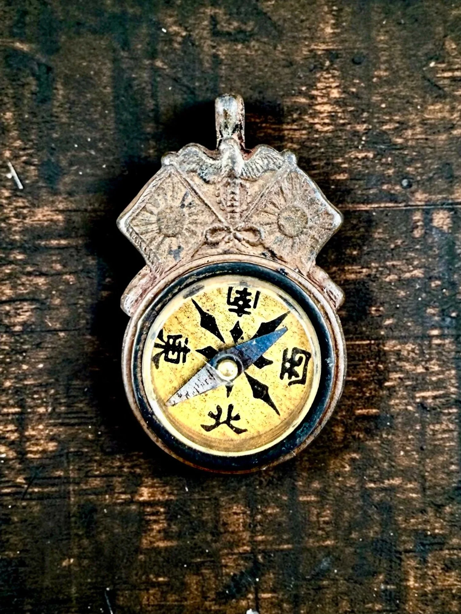 Meiji-era Japenese Military Compass Fob (working). 1 1/8" x 1 3/4". Obverse: Imperial eagle, crossed rising sun flags, "Light of the Nation, c. 1904-06 - $225