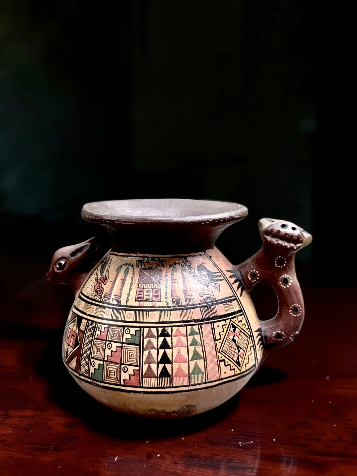 Signed Wily Cuno Surco Peruvian Folk Art Pottery Vessel With Animal Handles
Peru, late 20th century, hand-painted earthenware, signed Wily Cuno Surco, approximately 4" H × 5.5" W including handles, approximately 4" body width, 1.5" opening, weight 35