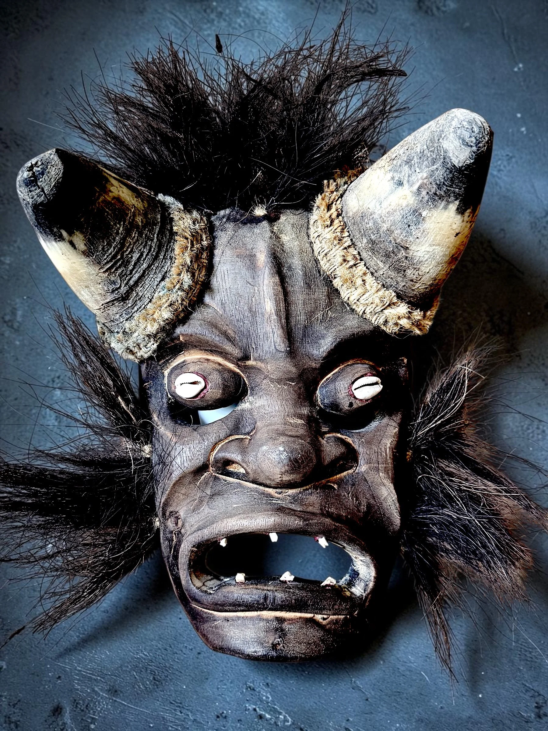 Wood Diablo Mask 1, Natural Horns/hair, Cowrie Shell Eyes, Carved teeth. c. Mid-20th century