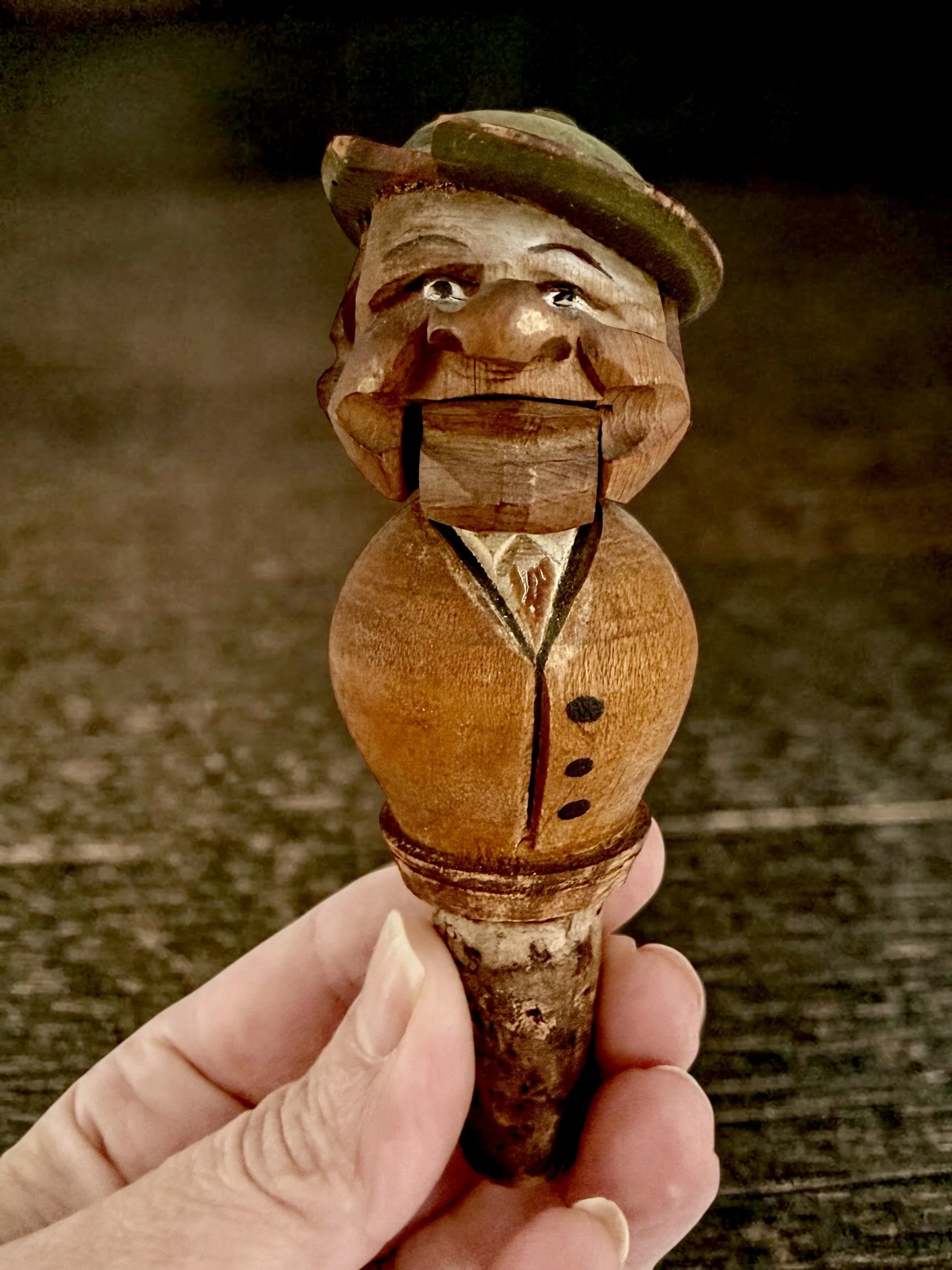 Black Forest carved wood mechanical bottle stopper, articulated jaw, condition note: chip on hat c. 1930s–50s — $100