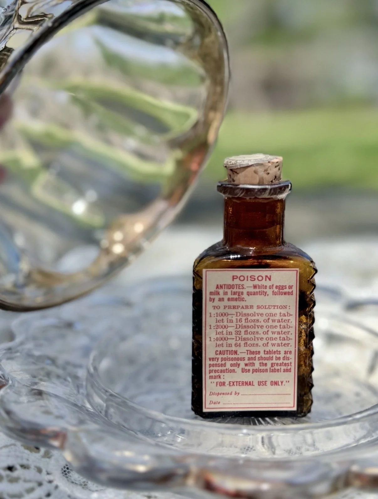 Antique amber glass poison bottle, original label, contents, and cork intact, c. 1900–1920 — $65