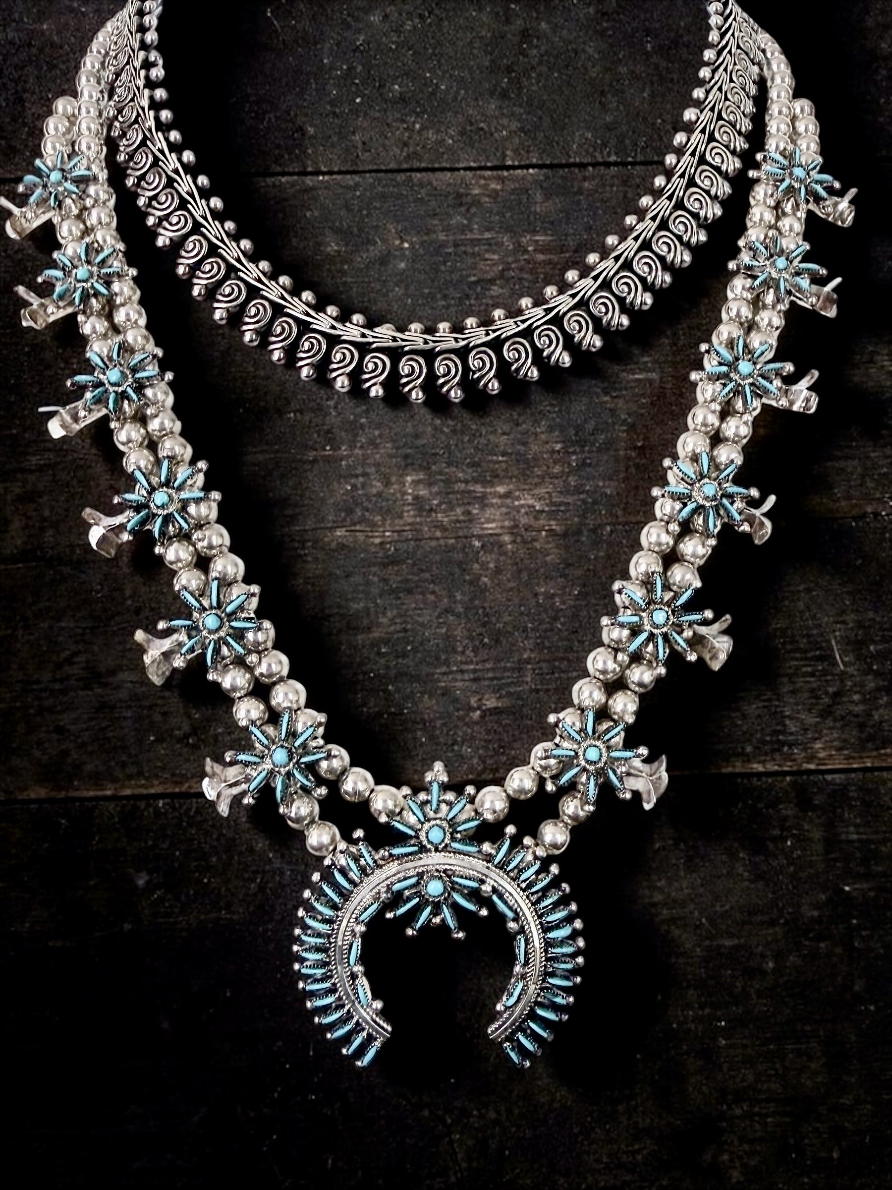 Sterling silver choker, 62.8g, India - $495
__ Signed Zuni needlpoint Sleeping Beauty Squash Blossom necklace - $1200