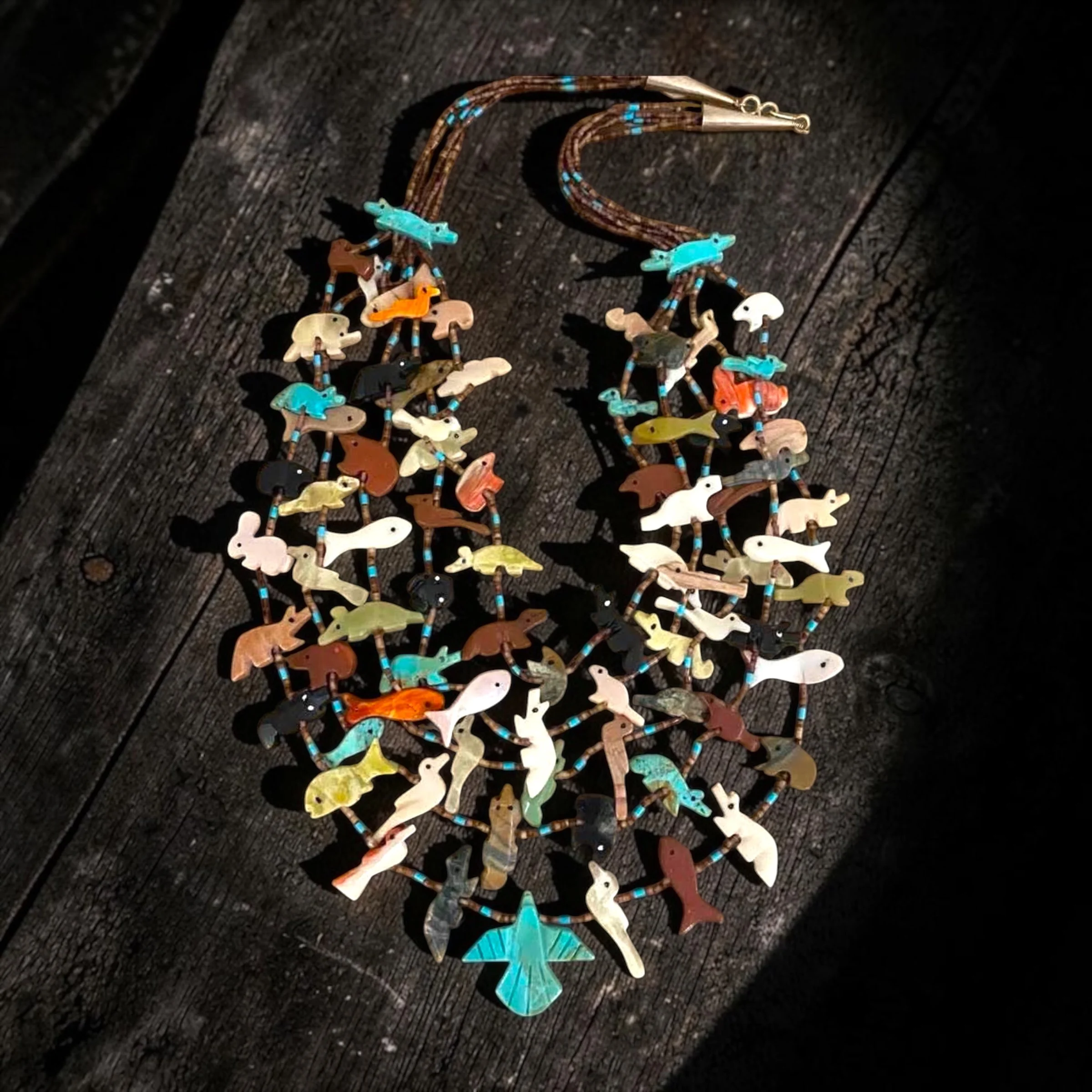 Five Strand Native American Fetish Necklace
Hand carved, c. 1970's
Turquoise, mother of pearl, spiny oyster shell, serpentine, jet, jasper, pipestone, pen shell Heishi
c. 1970s, unmarked