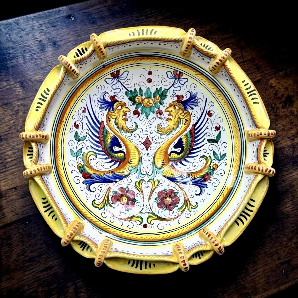 Vintage Sberna Deruta Sculptural Grottesche Maiolica Centerpiece Bowl
Sberna, Deruta, Italy, late 20th century, hand-painted maiolica, Renaissance Revival grottesche decoration, mirrored winged creatures, sculptural applied-loop rim, signed “Sberna D