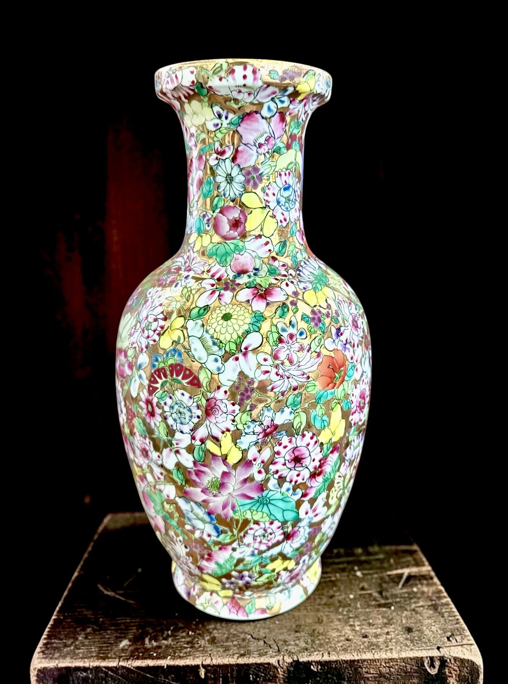 Large Antique Famille Rose Millefleur Vase, Porcelain Baluster Form. Thousand flowers pattern in polychrome enamel over continuous gold ground. Apocryphal Qianlong seal in iron red. Republic Period. 14.5" x 8"