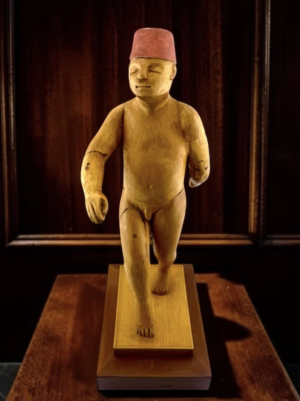 Donald Nelsen Modernist Painted Wood Walking Figure Sculpture With Fez
Painted carved wood figure by New York artist Donald Nelsen, depicting a walking male nude; signed by the artist.
Mounted on wood platform.
5.5ʺW × 4ʺD × 10.71ʺH