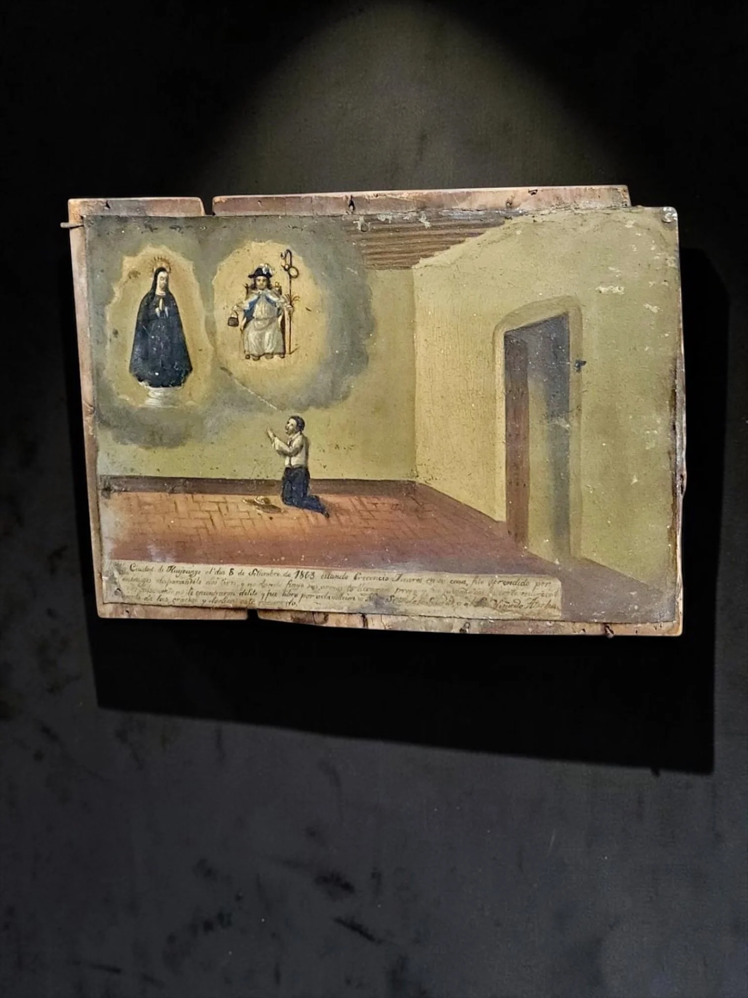 Mexican Folk Art Devotional Ex-Voto Retablo, Dated 1863
Mexican devotional ex-voto / retablo, dated October 6, 1863, inscription referencing Huajuapan, depicting a kneeling man praying before two sacred figures, hand-painted devotional panel mounted 