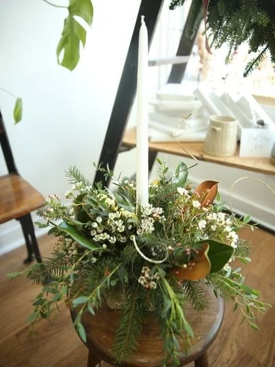 Christmas centerpieces are available while supplies last! They come in all different styles. Candle colors are white, red, or green with silver tin, birch, or porcelain bases. They are long lasting and perfect for your holiday table!